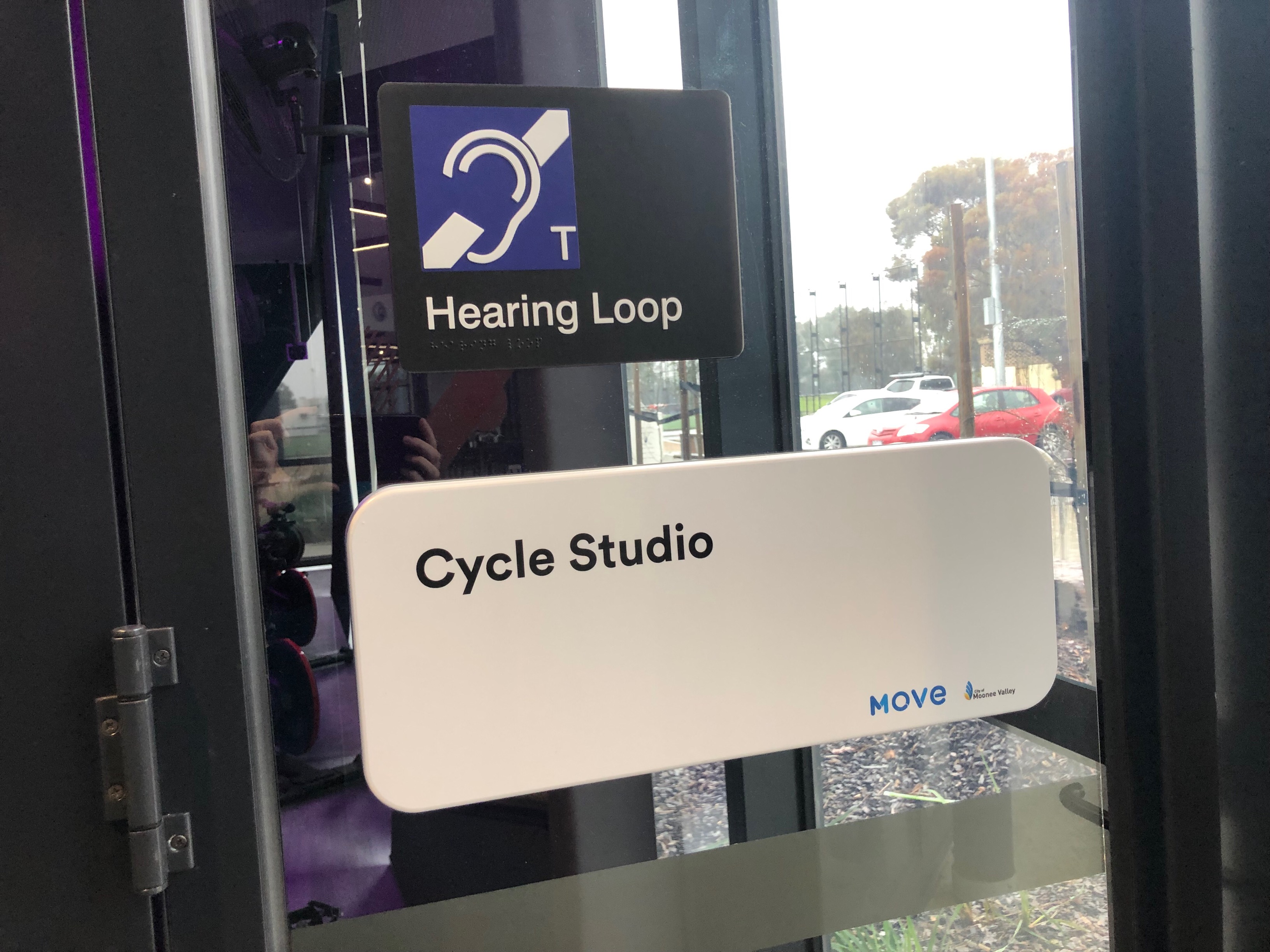 Image of Cycle Studio door with Hearing Loop signage