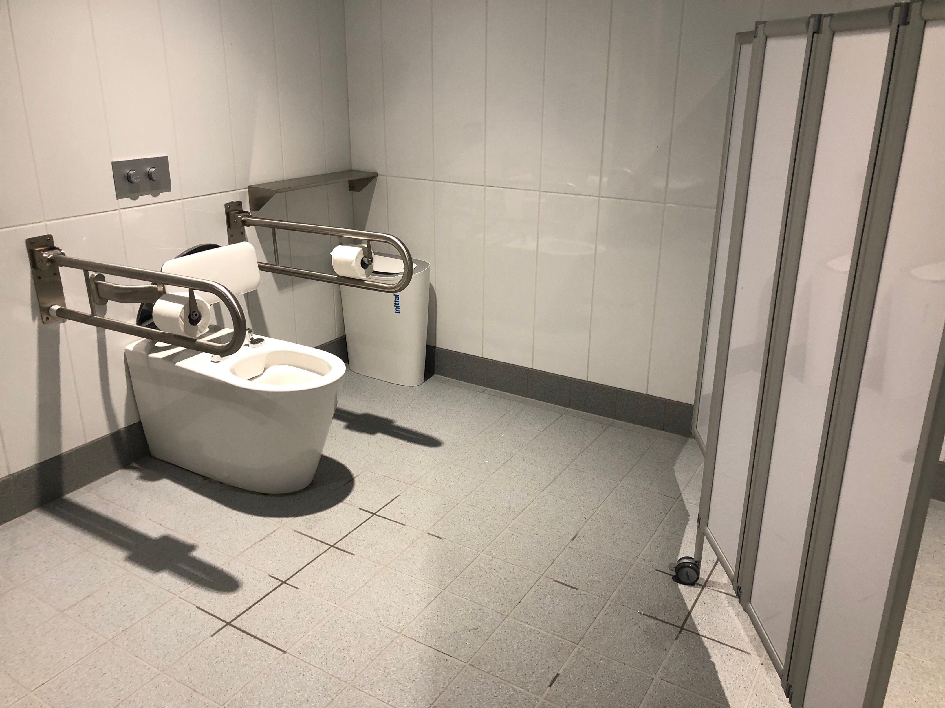 Image of accessible toilet facilities in the hoist changeroom, showcasing the handrails located on either side of the toilet.
