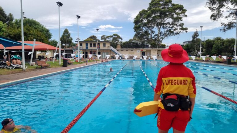 Lifeguard supervising indoor pool