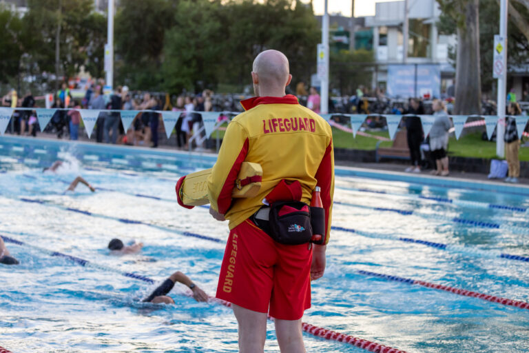 Lifeguard supervising outdoor pool