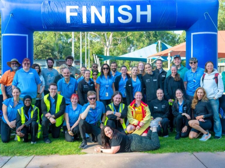 Group photo of triathletes at the finish line